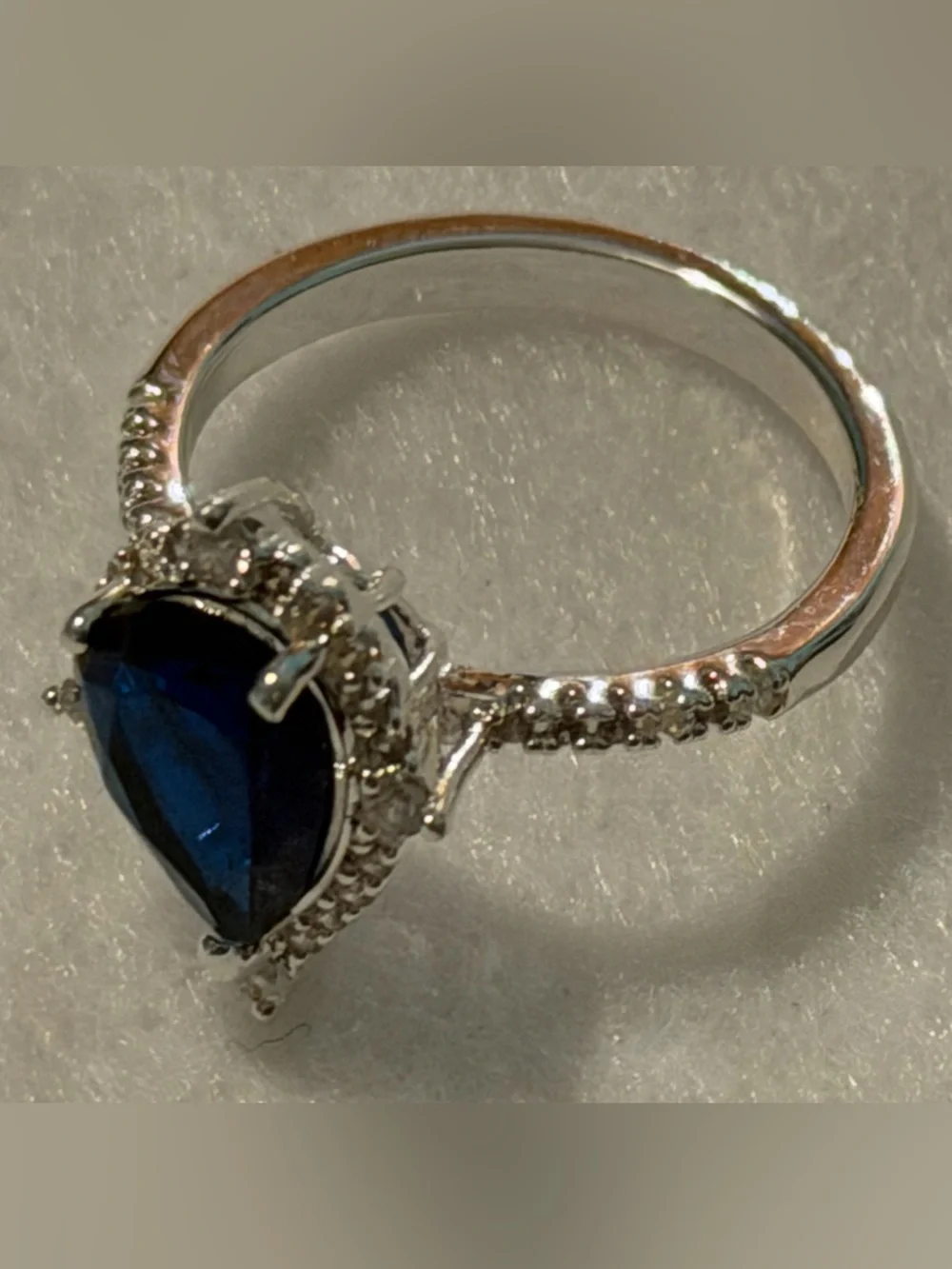 Silver Ring with Deep Blue Teardrop Stone and Pavé Accents